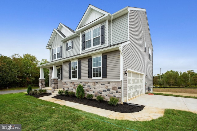 view of front of property with a front lawn and a garage