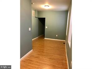 unfurnished room with light hardwood / wood-style floors