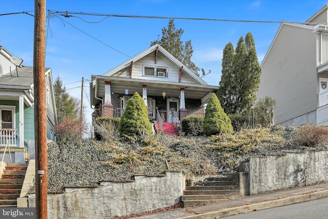32 S Jackson St, Pottsville, PA 17901 - bungalow-style house with stairway, a porch, and brick siding