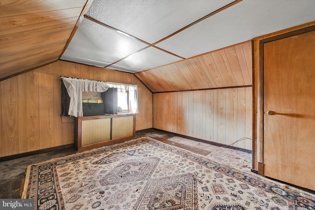 bonus room with wood walls, wood ceiling, and vaulted ceiling