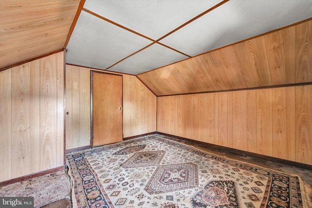 bonus room featuring wooden walls, wood ceiling, and lofted ceiling