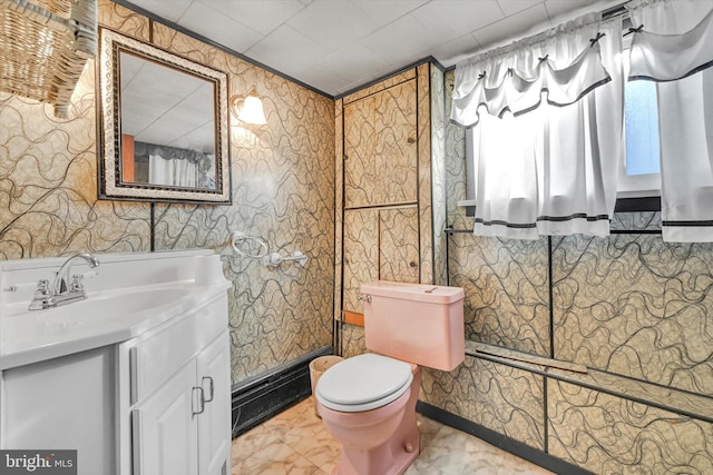 32 S Jackson St, Pottsville, PA 17901 - bathroom featuring toilet, vanity, and wallpapered walls