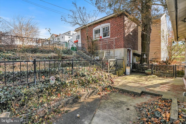 back of property with a patio area