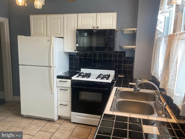 kitchen with tile counters, sink, white cabinetry, decorative backsplash, and white appliances