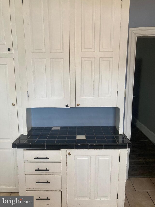 interior details featuring tile patterned flooring