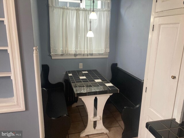 dining area with tile patterned flooring