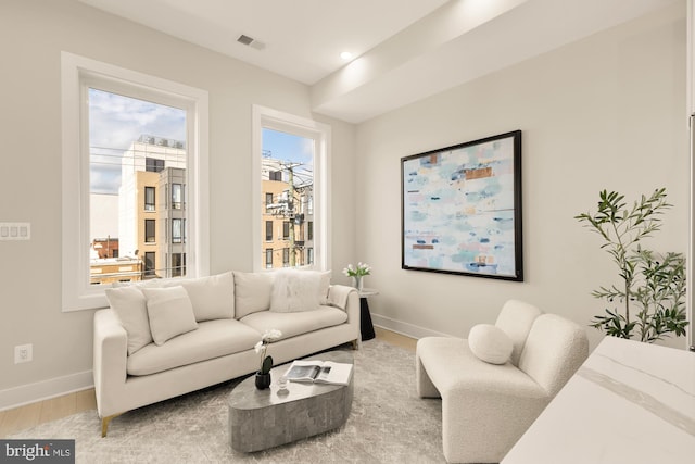 living room with light hardwood / wood-style flooring