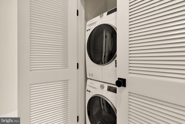 laundry room with stacked washer and clothes dryer