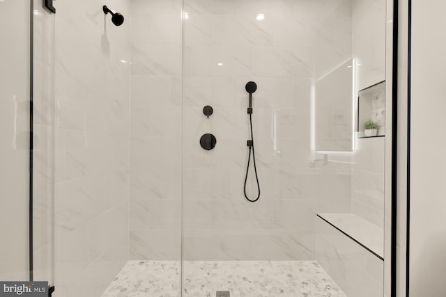 bathroom featuring tiled shower