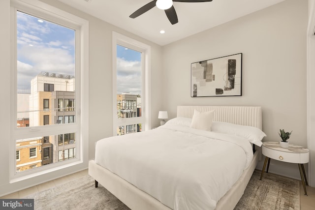 tiled bedroom with ceiling fan