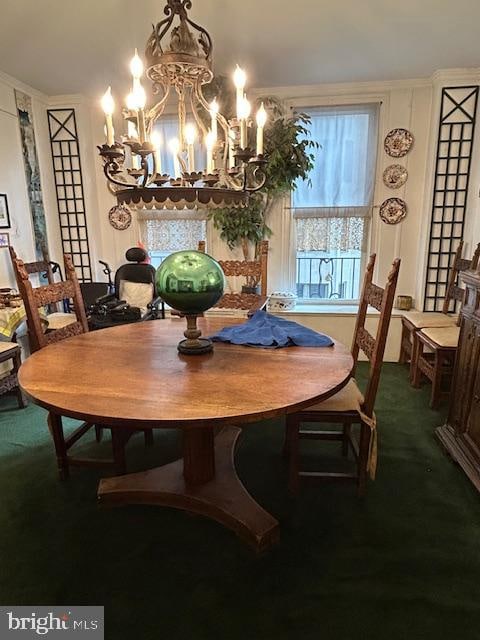 dining room featuring a notable chandelier and carpet flooring