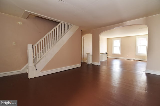 unfurnished living room featuring wood-type flooring