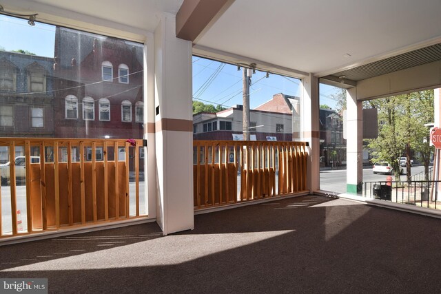 unfurnished sunroom featuring a healthy amount of sunlight