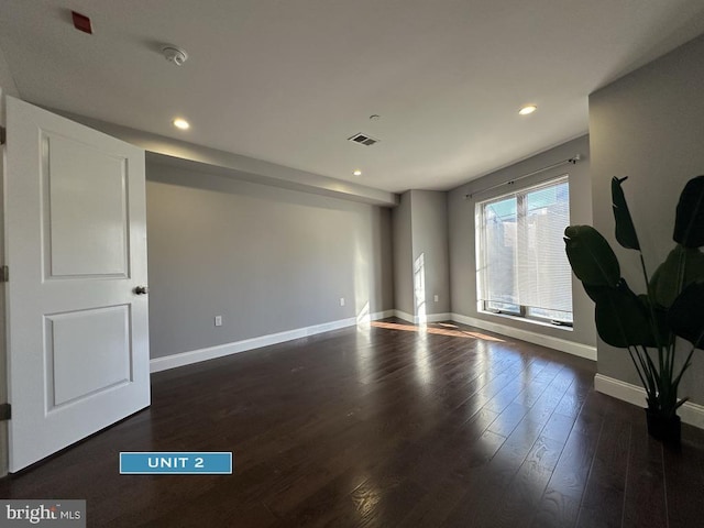 1606 Point Breeze Ave, Philadelphia, PA 19145 - spare room with baseboards, dark wood-style flooring, recessed lighting, and a smoke detector