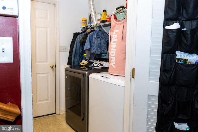 clothes washing area featuring washing machine and dryer