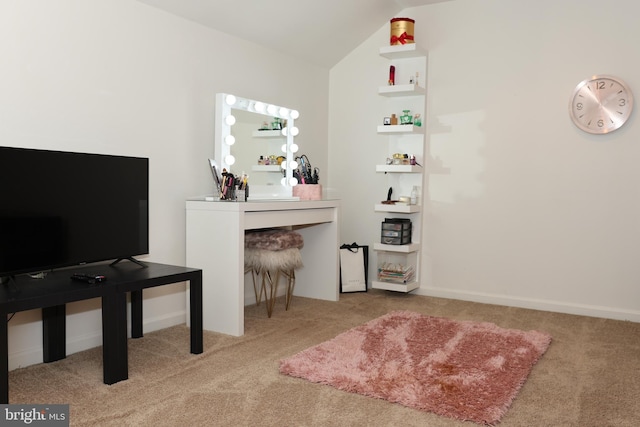 interior space with lofted ceiling and light carpet