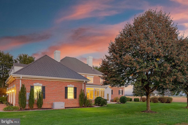 20459 Troyer Ln, Lincoln, DE 19960 - view of front of property with brick siding, a chimney, and a front lawn