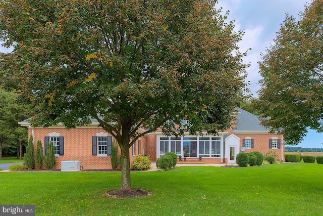20459 Troyer Ln, Lincoln, DE 19960 - exterior space with brick siding, a sunroom, and a front lawn