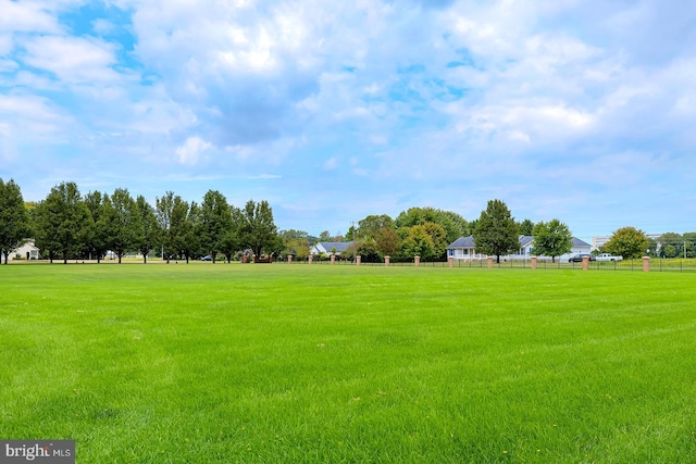 view of property's community featuring a yard