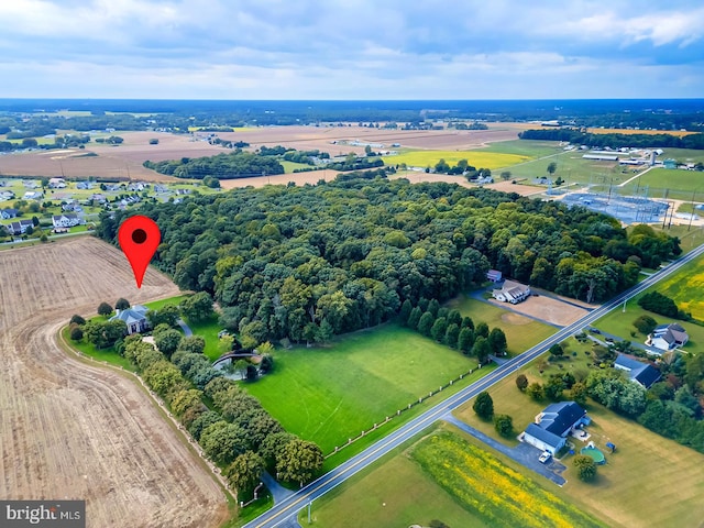 birds eye view of property with a rural view