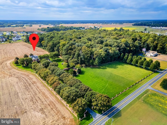 birds eye view of property with a rural view