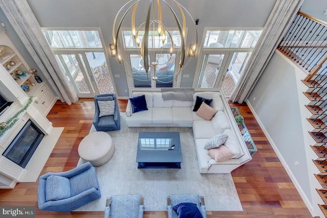 living room featuring a notable chandelier and hardwood / wood-style flooring