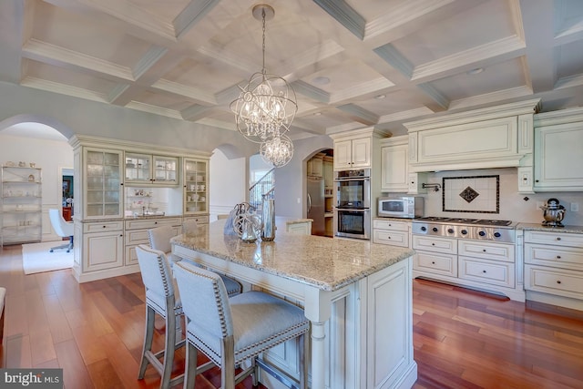 20459 Troyer Ln, Lincoln, DE 19960 - kitchen featuring beam ceiling, appliances with stainless steel finishes, and arched walkways
