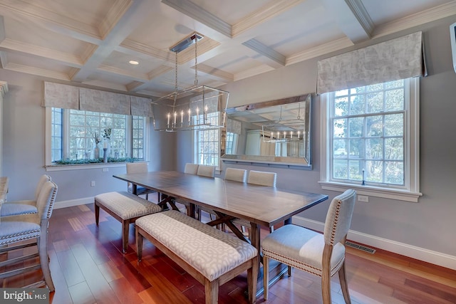 dining space with beamed ceiling, crown molding, wood-type flooring, and coffered ceiling