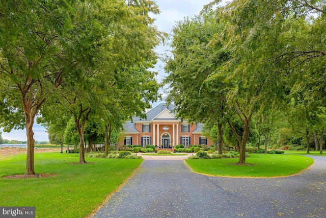 neoclassical / greek revival house with a front lawn