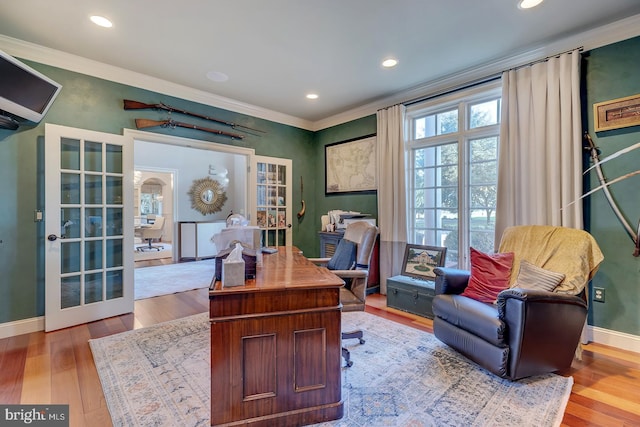 office space featuring crown molding and light wood-type flooring