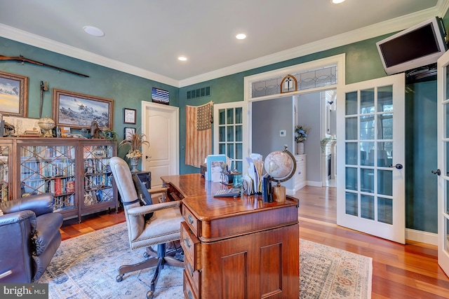 office space featuring crown molding and hardwood / wood-style flooring