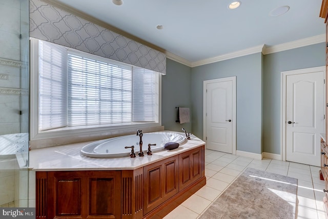 bathroom with tile patterned floors, crown molding, and a bath