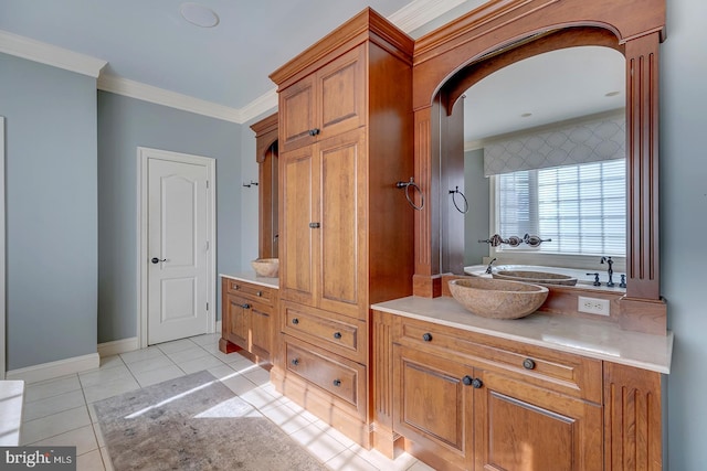 bathroom with vanity, ornamental molding, and tile patterned flooring