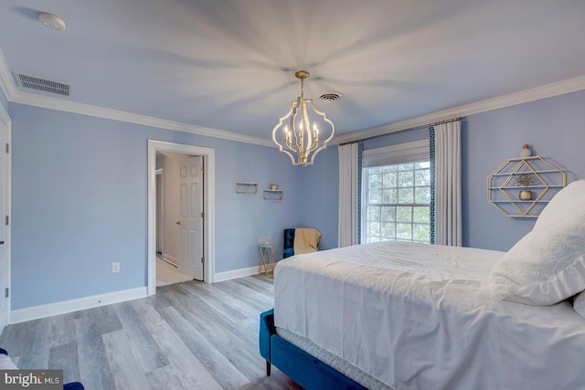 bedroom featuring crown molding, a notable chandelier, and hardwood / wood-style flooring