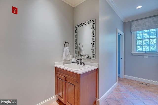 bathroom featuring vanity, tile patterned floors, and ornamental molding