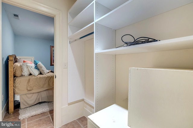 spacious closet with tile patterned flooring