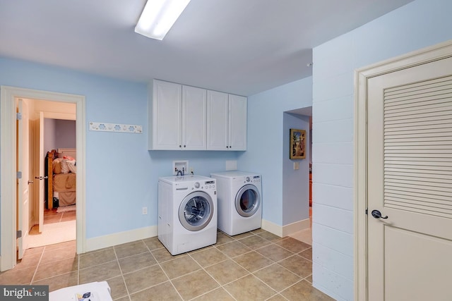 20459 Troyer Ln, Lincoln, DE 19960 - washroom featuring light tile patterned floors, separate washer and dryer, baseboards, and cabinet space