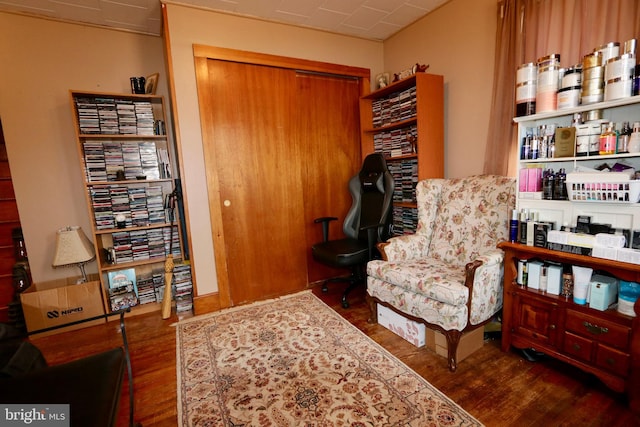 sitting room with dark hardwood / wood-style flooring