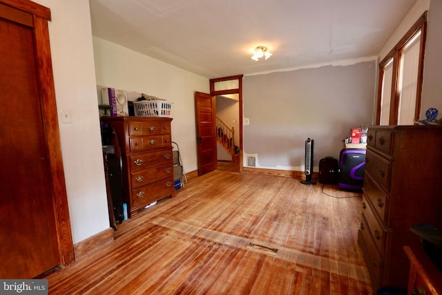 bedroom with light hardwood / wood-style floors