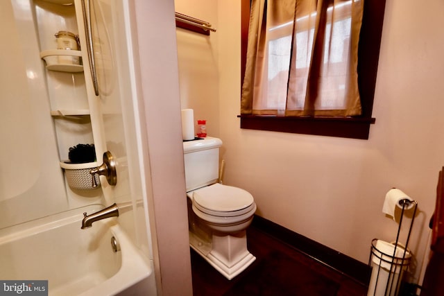 bathroom featuring  shower combination and toilet