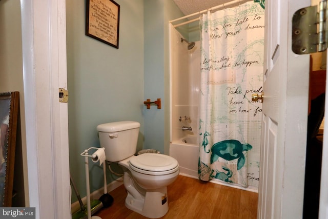 bathroom featuring shower / bath combination with curtain, wood-type flooring, and toilet