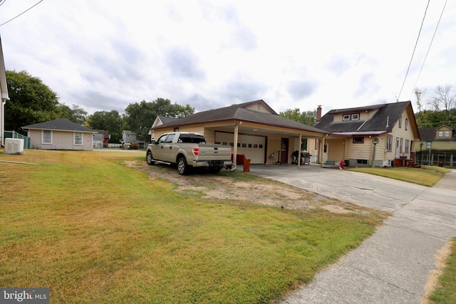 view of front of home featuring a front yard and a garage