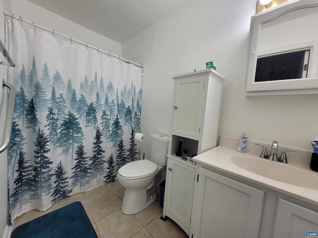 bathroom with tile patterned flooring, curtained shower, vanity, and toilet