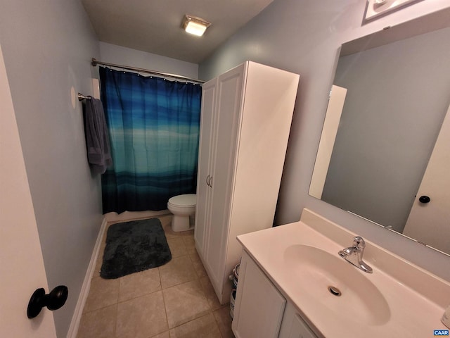 bathroom with walk in shower, tile patterned floors, vanity, and toilet