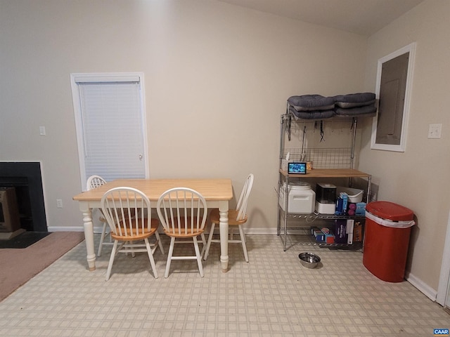 carpeted dining room with vaulted ceiling