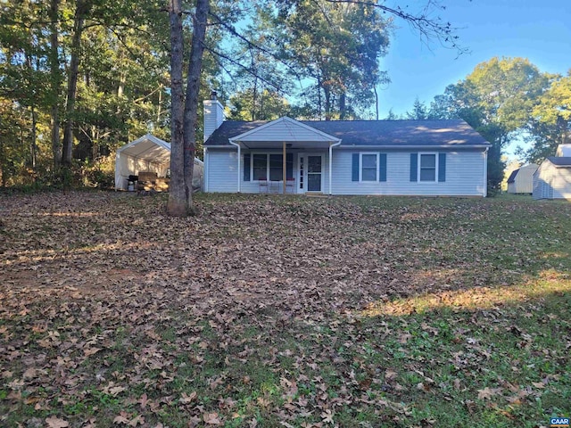 single story home with a storage unit