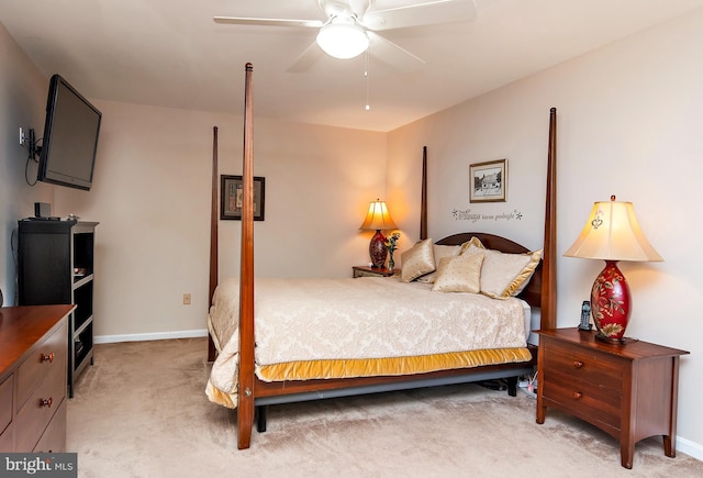 bedroom featuring ceiling fan and light carpet