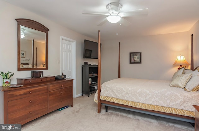 bedroom featuring ceiling fan and light colored carpet