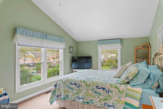 bedroom with lofted ceiling and carpet