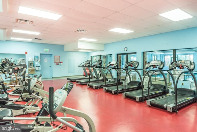 exercise room featuring a drop ceiling